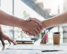 business-people-doing-handshake-desk