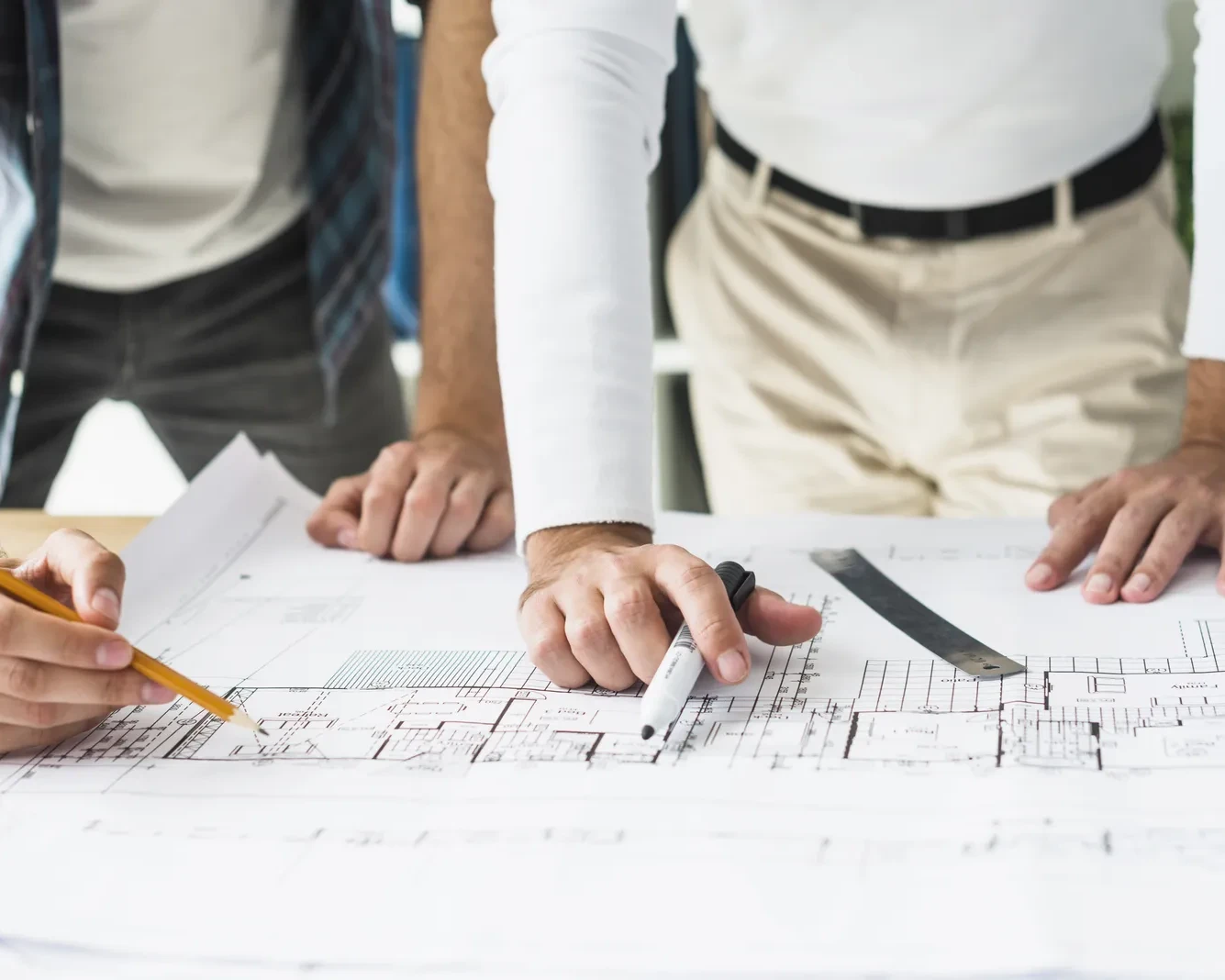 close-up-two-male-architect-s-hand-blueprint